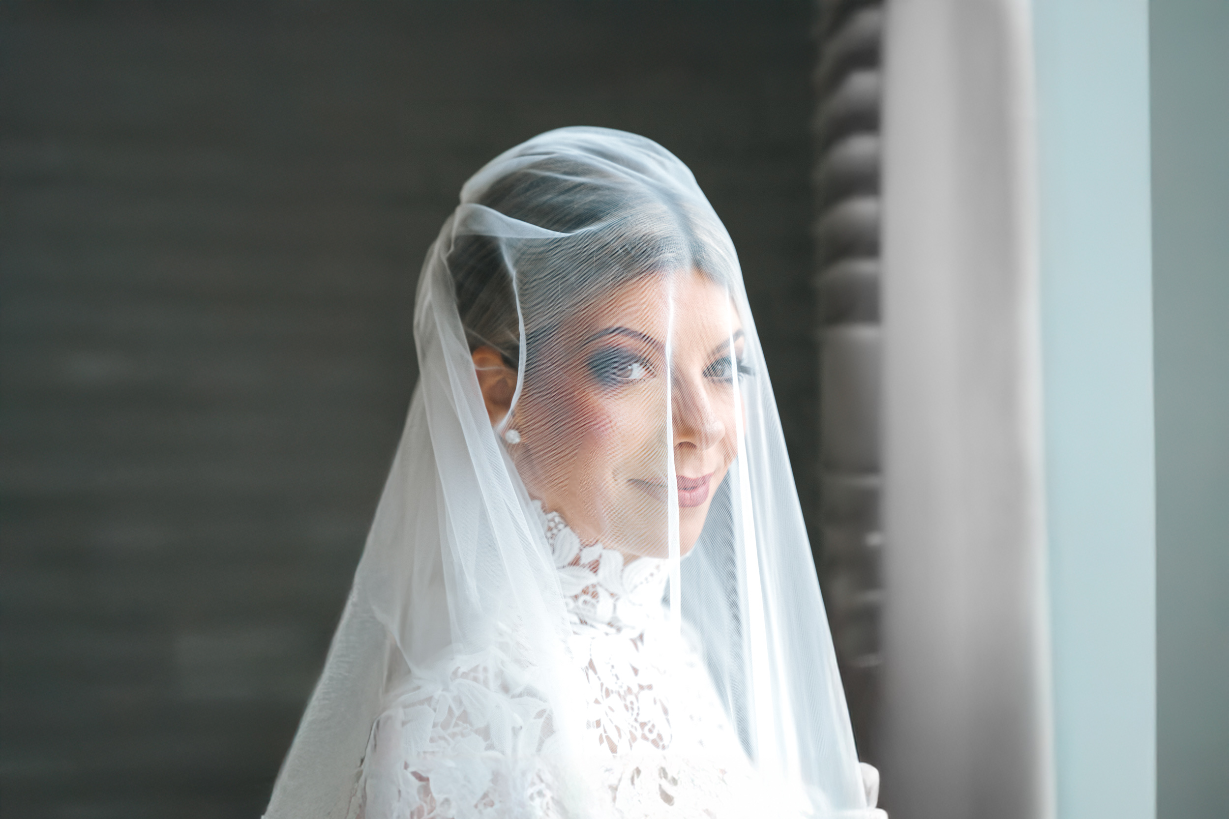 stunning bride wearing veil over her head at the Southern Hotel in Covington, Louisiana