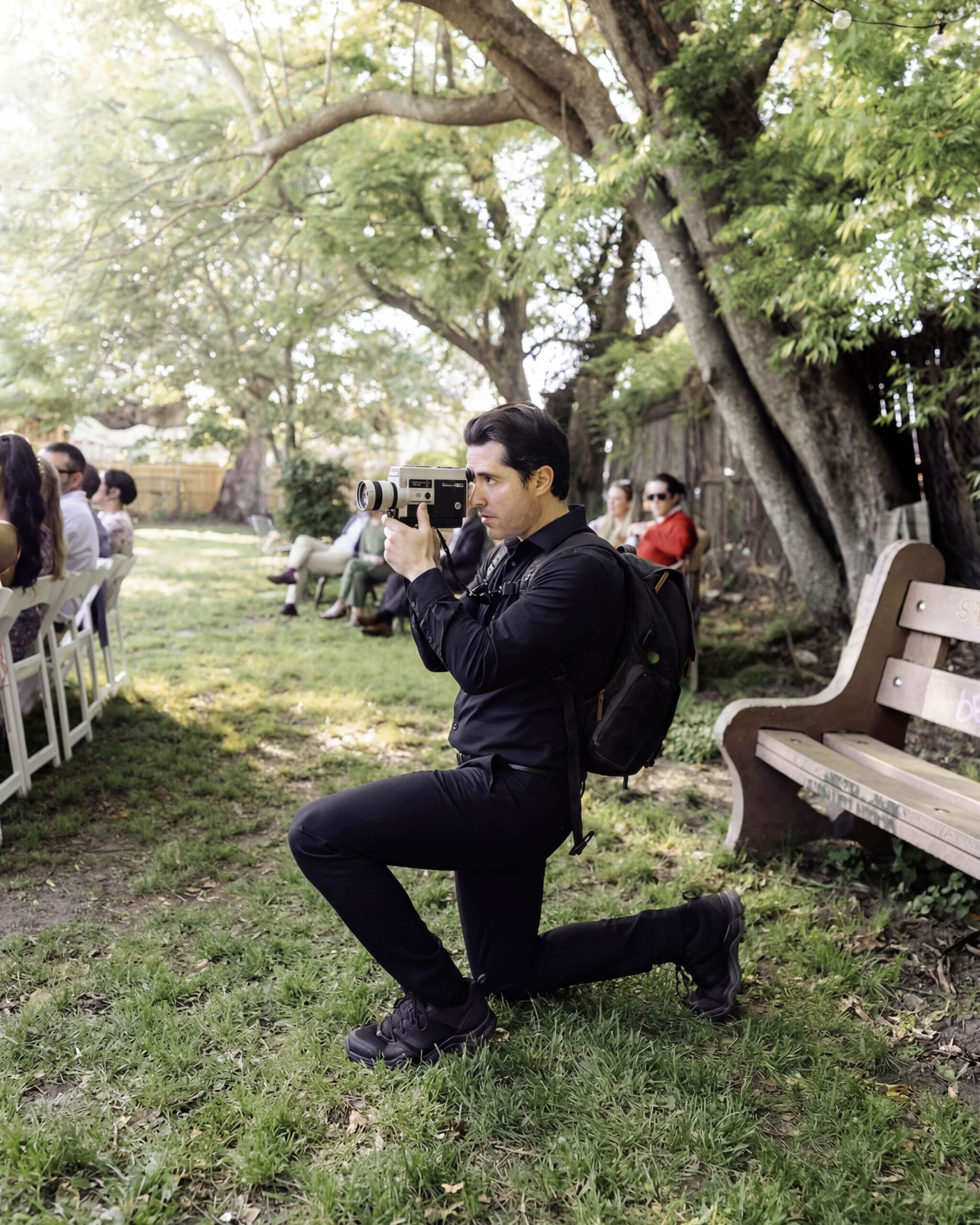 Super 8 Wedding Filmmaker at Clouet Gardens in Bywater New Orleans New Orleans Super 8 wedding filmmaker capturing an intimate ceremony at Clouet Gardens in Bywater with a vintage film camera.