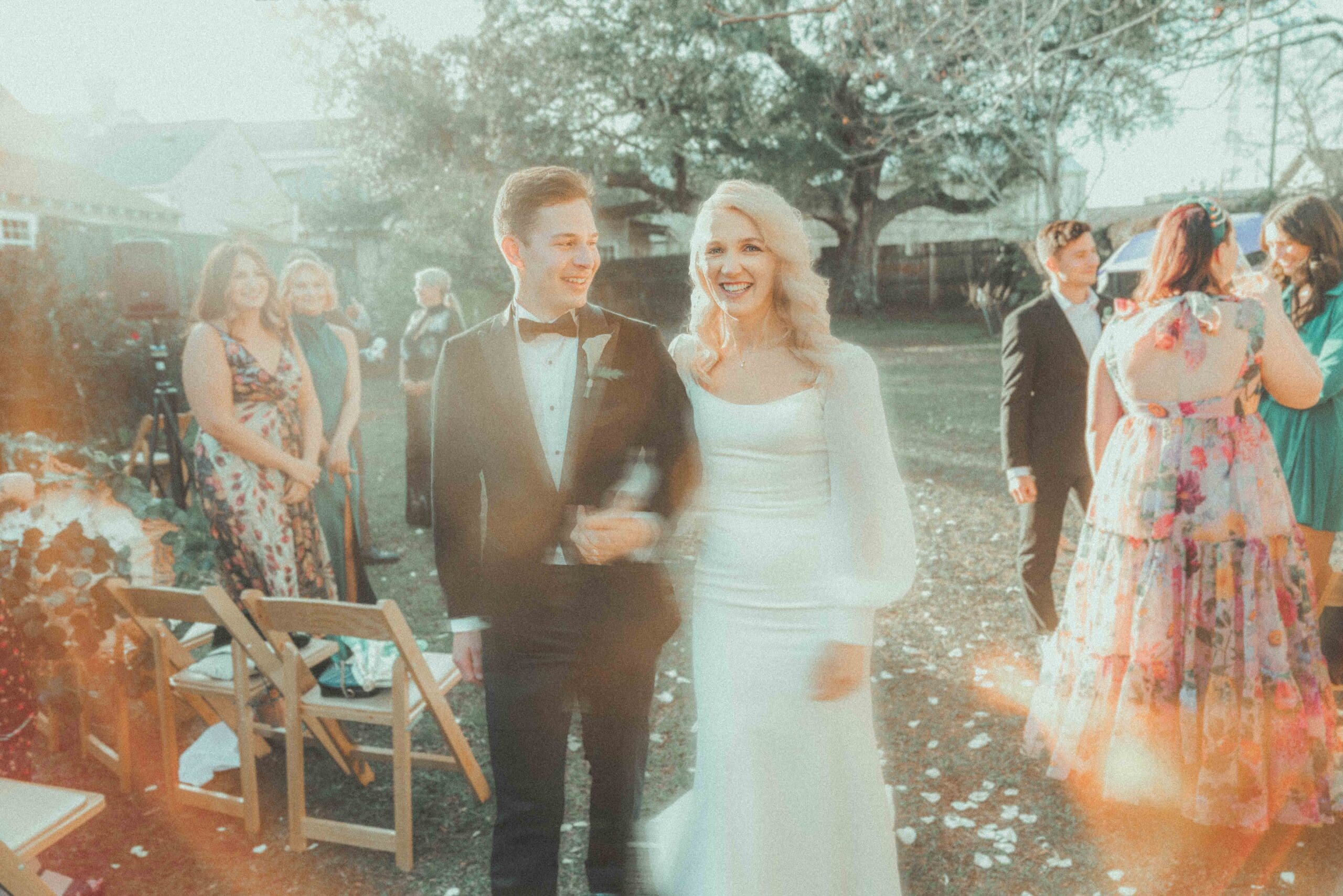 super-8-wedding-film-clouet-gardens-bywater-new-orleans.jpg Super 8 wedding film still of a couple walking at Clouet Gardens in the Bywater, New Orleans.